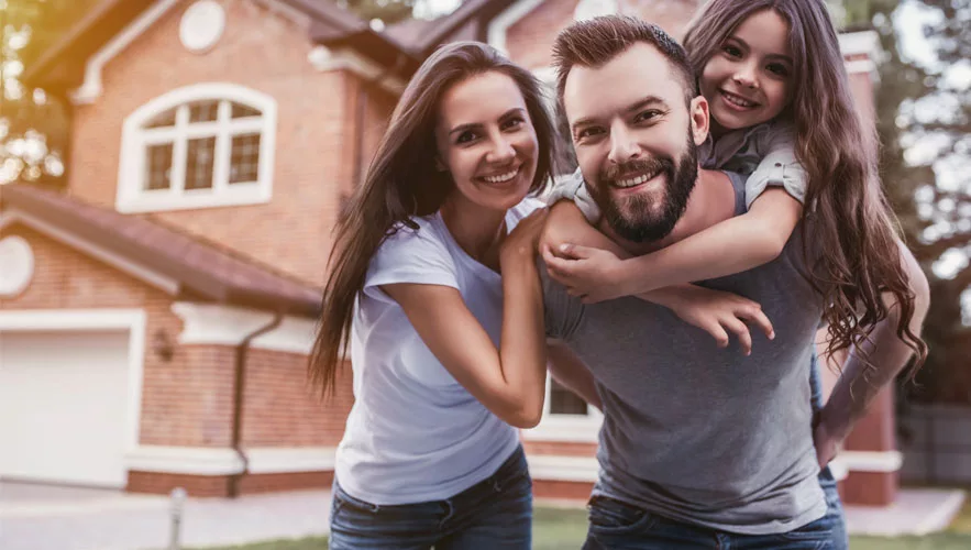 Happy family in their front yard