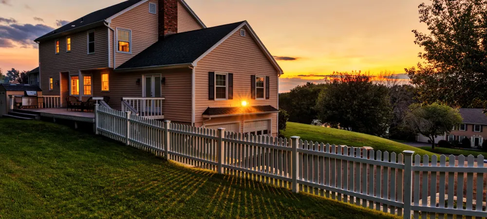 house with fence that is protected from perimeter pest control