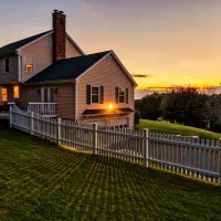 house with fence that is protected from perimeter pest control